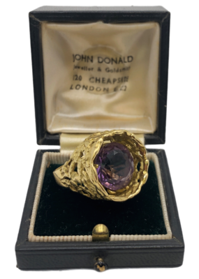 An 18ct gold and amethyst abstract ring, by John Donald